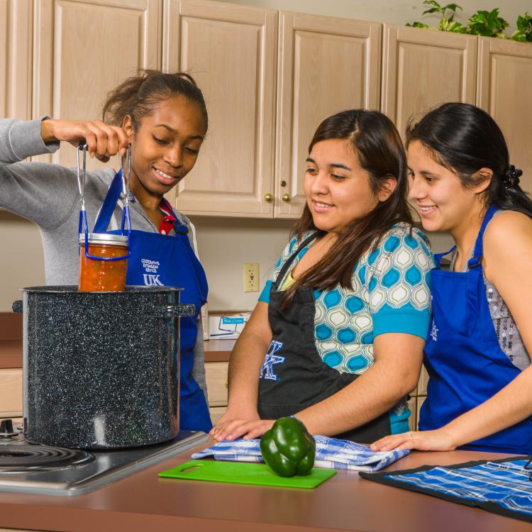  3 women with canning jar